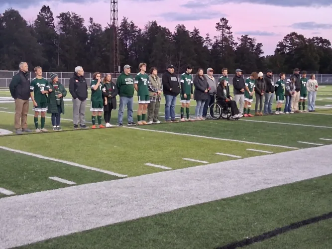 Alpena wins gritty battle on Senior Night